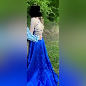 open back with then straps that cross and a silky royal blue color